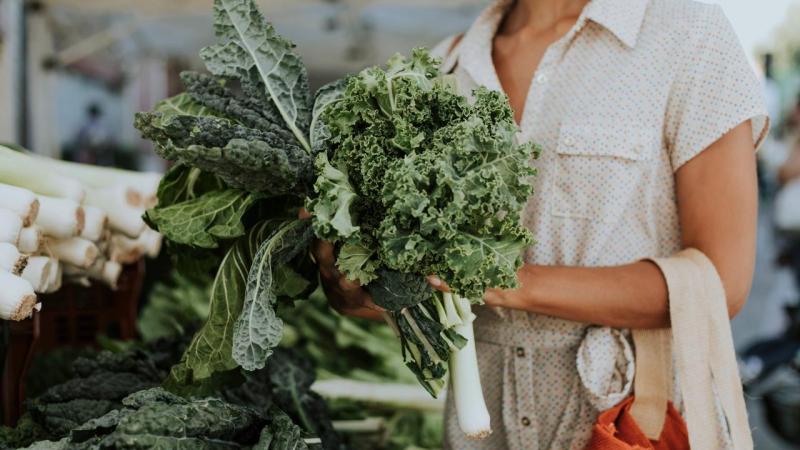 Holding a buck of kale